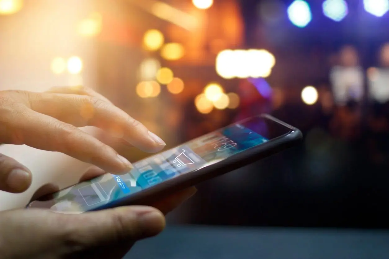 A person is holding their phone in his hand.